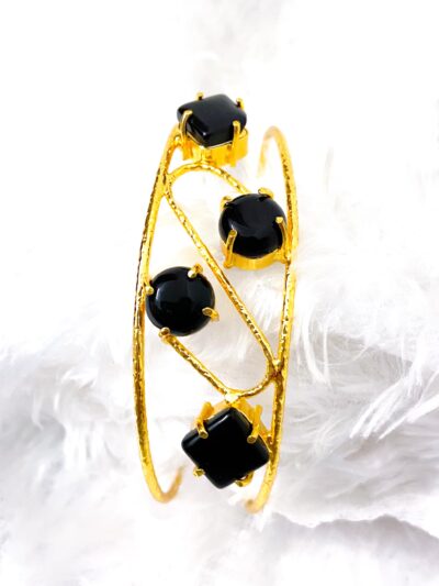 Golden bracelets with stones (black stones)