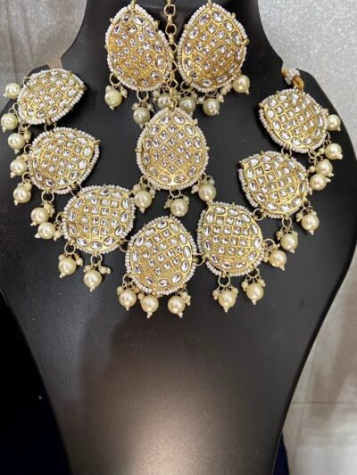 Golden Kundan Set with White pearls.
