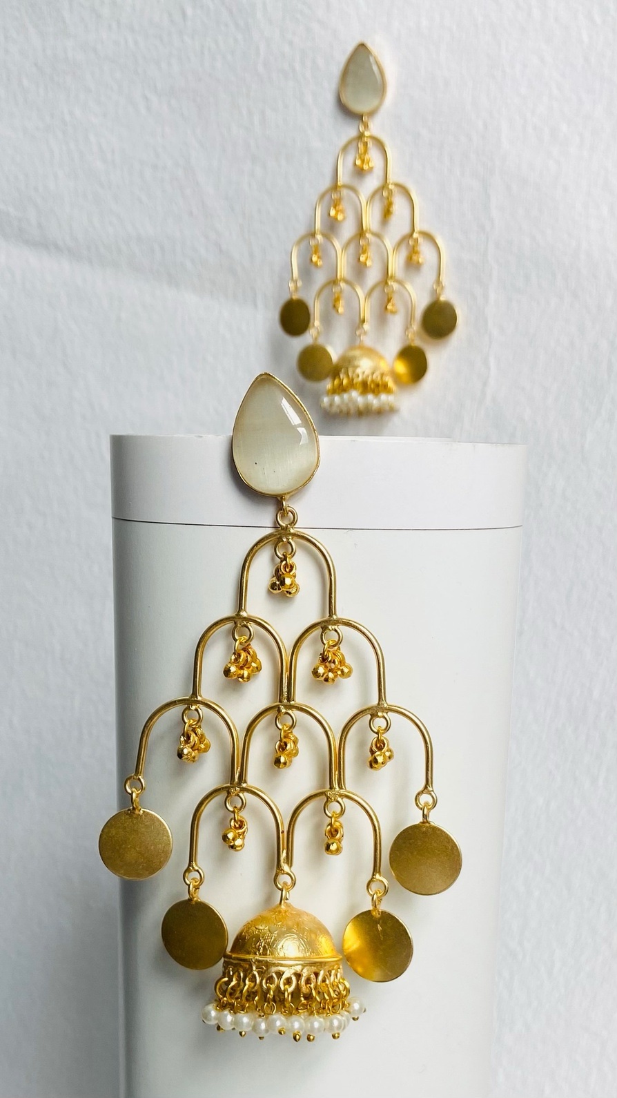 Elegant gold-plated statement earrings with cascading details for a bold traditional look.