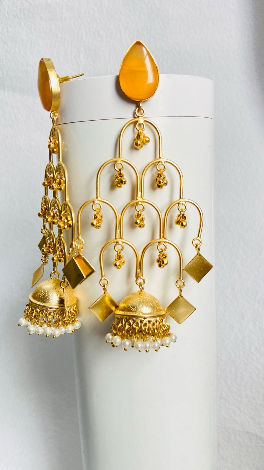 Elegant gold-plated statement earrings with cascading details for a bold traditional look.