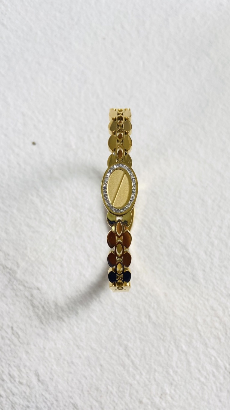 Elegant gold-plated bracelet with a contemporary design and shimmering accents. - Image 3