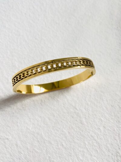 Sleek gold bangle with an intricate chain-link design