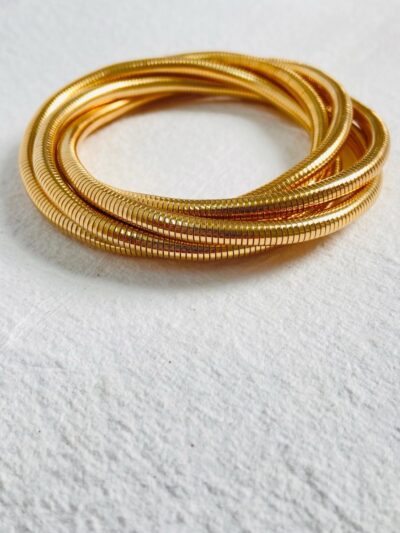 Chic gold coil bangles for a modern and stylish look.